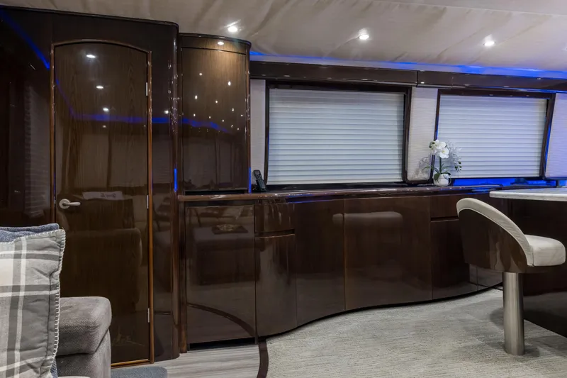 "el Jefe" Yacht Photos Pics Luxurious interior of 2014 Viking 70 Convertible yacht with sleek cabinetry and modern decor.