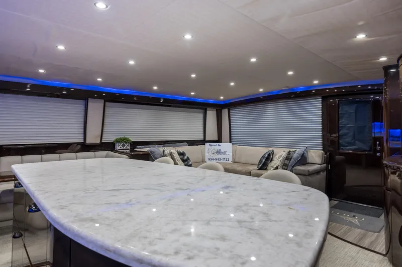 "el Jefe" Yacht Photos Pics Luxurious interior of 2014 Viking 70 Convertible yacht with marble countertop and plush seating.