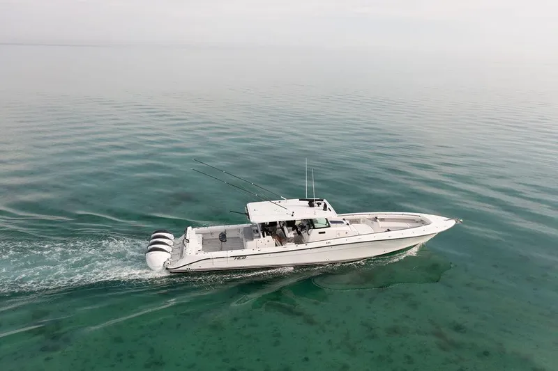  Yacht Photos Pics 2019 HCB 53 boat cruising on calm, clear waters.