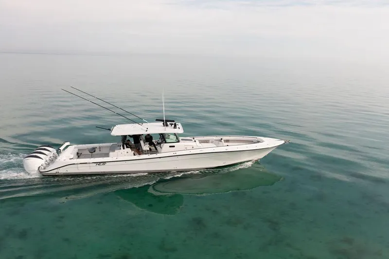  Yacht Photos Pics 2019 HCB 53 boat cruising on calm, clear water.
