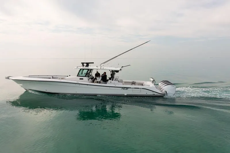  Yacht Photos Pics 2019 HCB 53 boat cruising on calm water, side view.