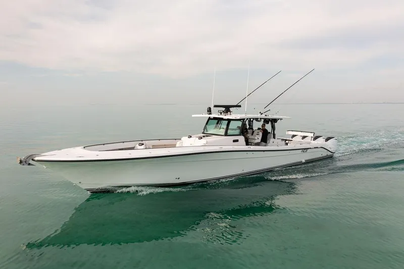  Yacht Photos Pics 2019 HCB 53 boat cruising on calm water, side view.