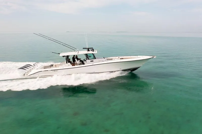  Yacht Photos Pics 2019 HCB 53 boat cruising on clear turquoise water.