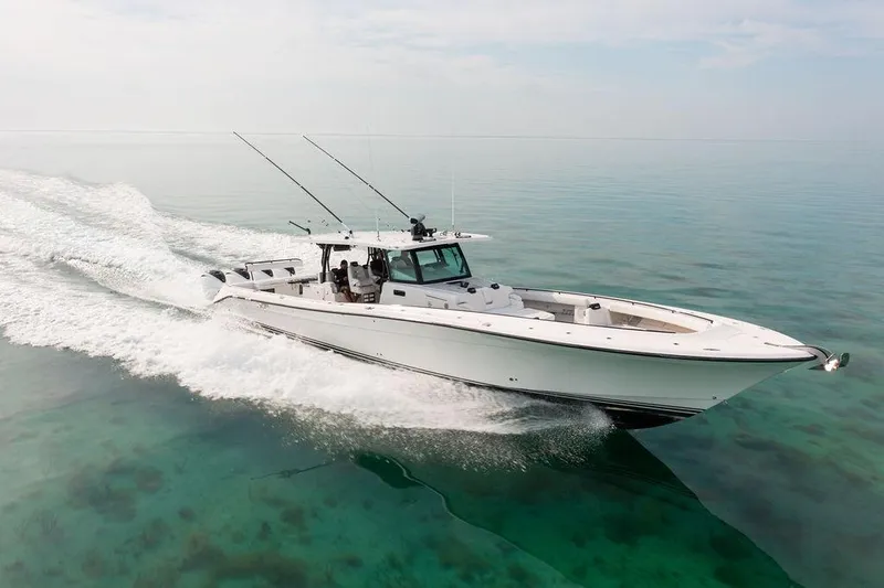  Yacht Photos Pics 2019 HCB 53 boat cruising on clear turquoise water.