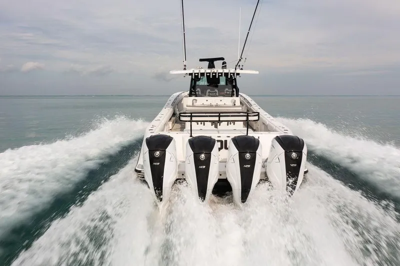  Yacht Photos Pics 2019 HCB 53 boat with four powerful engines cruising on open water.