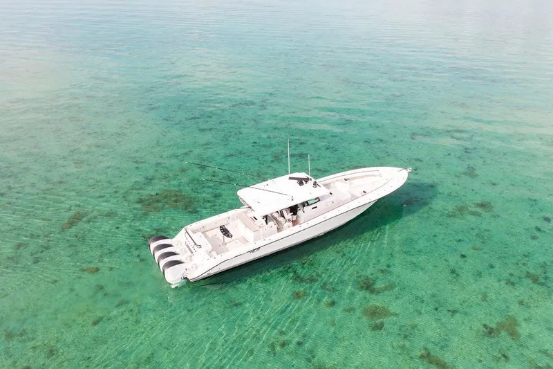  Yacht Photos Pics Aerial view of 2019 HCB 53 boat on clear turquoise water.