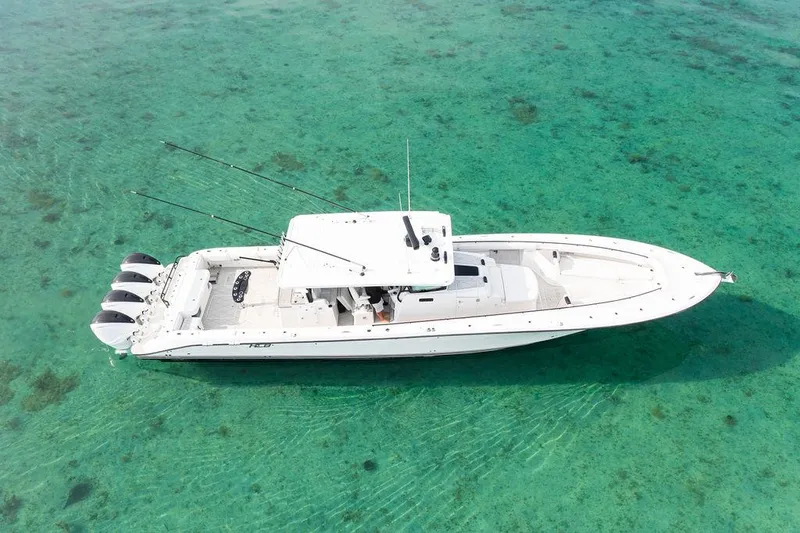  Yacht Photos Pics 2019 HCB 53 boat on clear turquoise water, aerial view.