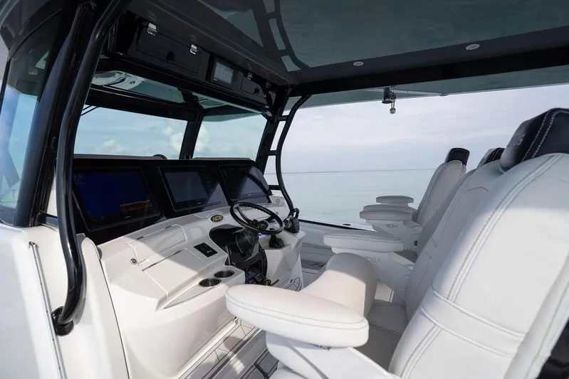  Yacht Photos Pics Interior of 2019 HCB 53 boat with modern helm and luxurious seating.