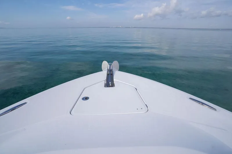  Yacht Photos Pics Bow view of 2019 HCB 53 boat on calm ocean waters.