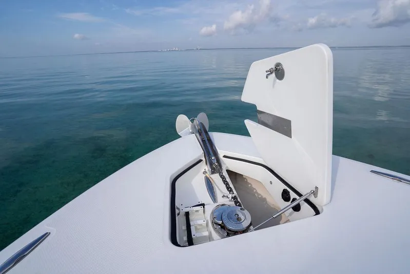  Yacht Photos Pics Bow of 2019 HCB 53 boat with anchor compartment open on calm sea.