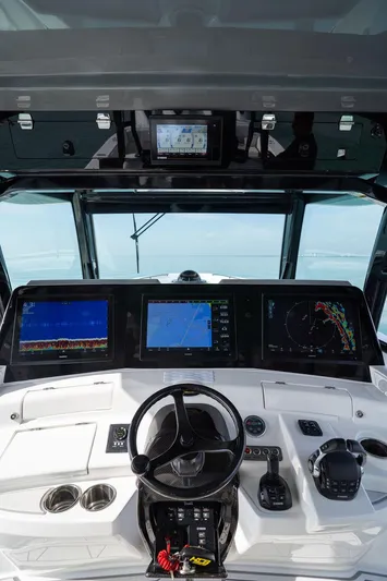  Yacht Photos Pics Helm of 2019 HCB 53 boat with advanced navigation displays and controls.
