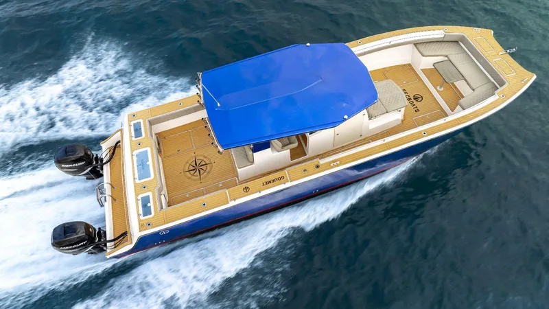 Sec Catfish 39 Yacht Photos Pics Custom Catamaran Sec CatFish 39, 2023 model, cruising on water with blue canopy.