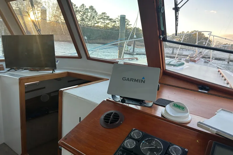  Yacht Photos Pics Interior of a 1991 Holland 38 boat with Garmin navigation system and scenic view.