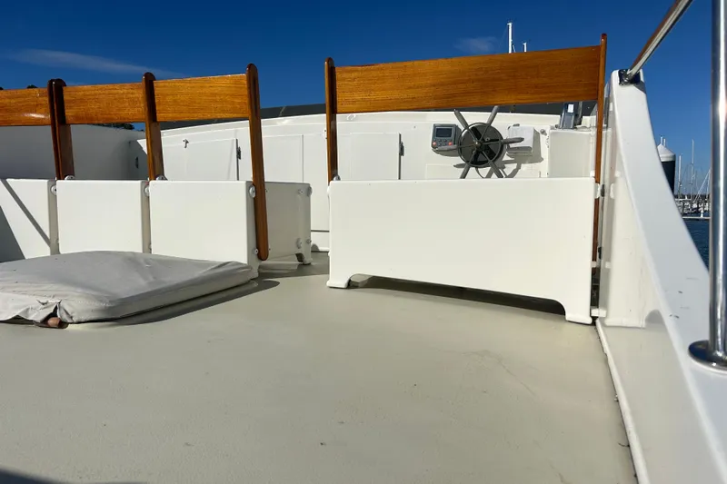  Yacht Photos Pics Deck of 1991 Holland 38 boat with wooden seats and steering wheel.