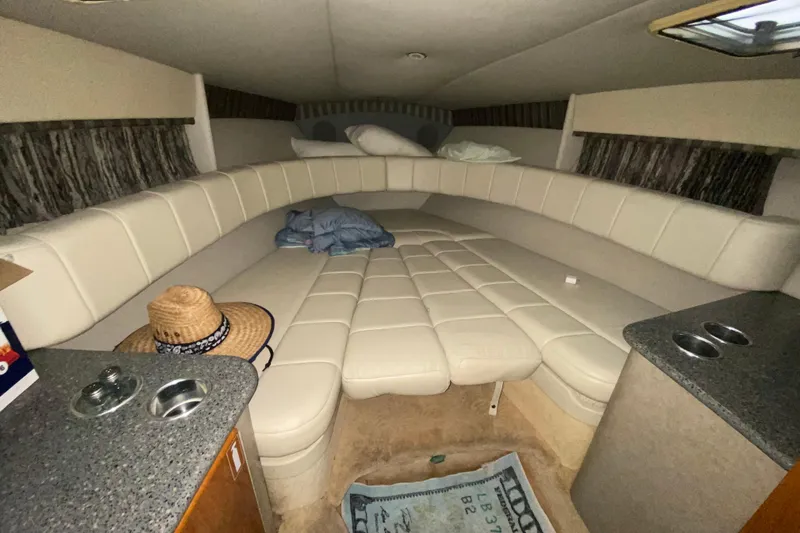  Yacht Photos Pics Interior cabin of a 2005 Formula 330 Sun Sport boat with beige seating.