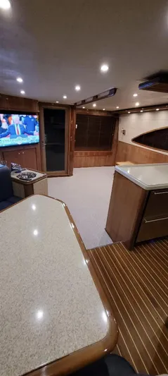  Yacht Photos Pics Luxurious interior of 2004 Bertram 630 yacht with modern amenities and wood finishes.
