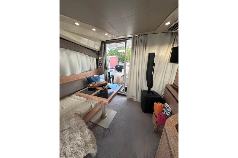 3 Princess Yacht Photos Pics Luxurious interior of a 2011 Azimut 38 yacht with modern furnishings and decor.