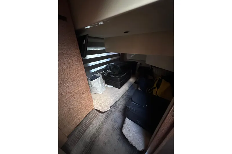 3 Princess Yacht Photos Pics Interior cabin of 2011 Azimut 38 yacht with luggage and bags.