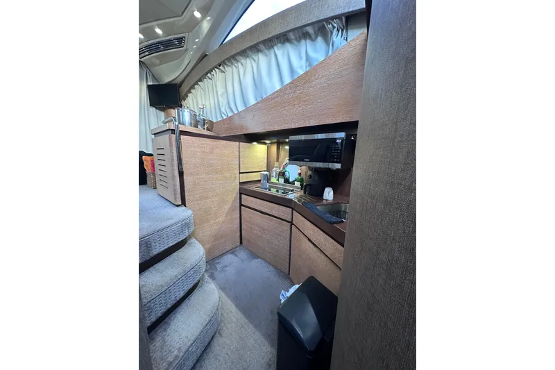 3 Princess Yacht Photos Pics Interior of 2011 Azimut 38 yacht kitchen with modern appliances and wooden cabinetry.