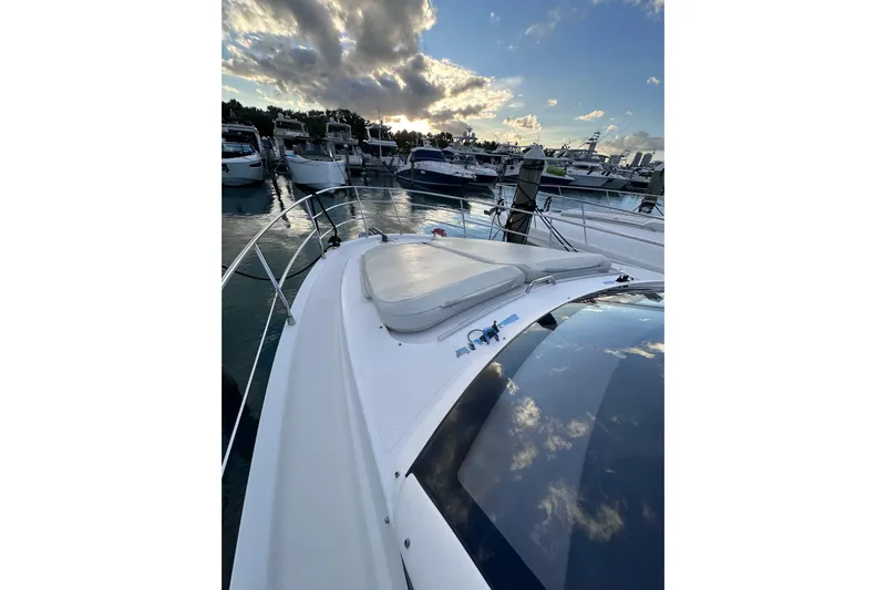 3 Princess Yacht Photos Pics 2011 Azimut 38 yacht docked at marina under a cloudy sky.