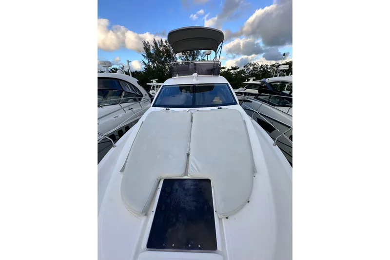 3 Princess Yacht Photos Pics 2011 Azimut 38 yacht with sleek design, docked under a partly cloudy sky.