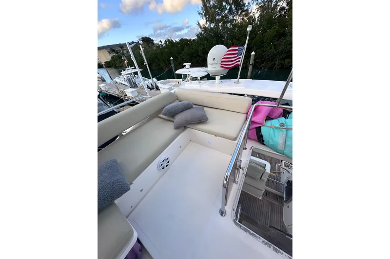 3 Princess Yacht Photos Pics 2011 Azimut 38 yacht deck with seating, cushions, and American flag.