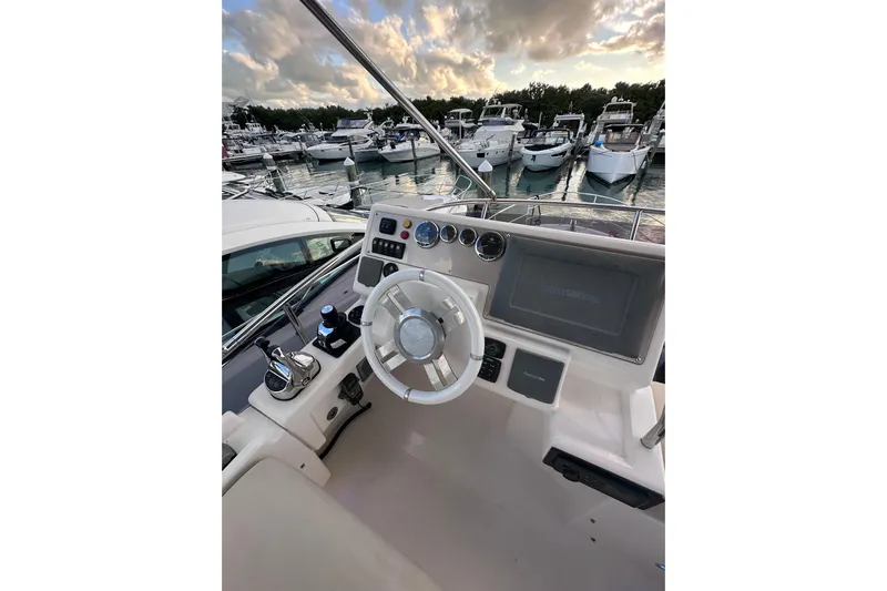 3 Princess Yacht Photos Pics Cockpit view of 2011 Azimut 38 yacht with marina backdrop.