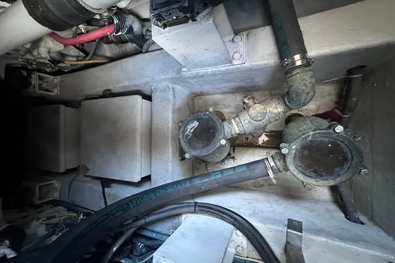 3 Princess Yacht Photos Pics Engine compartment of a 2011 Azimut 38 yacht, showing pipes and mechanical components.