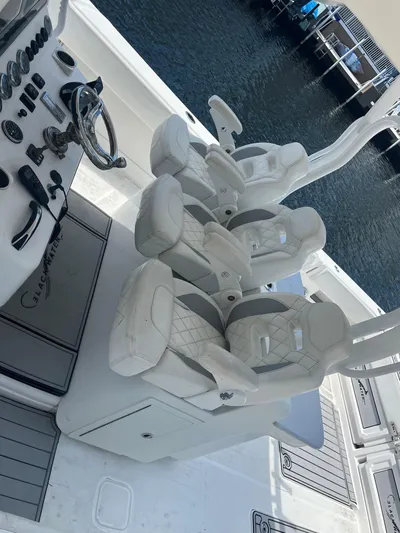  Yacht Photos Pics Luxury seating on a 2018 Blackwater 43 boat, featuring modern helm controls.