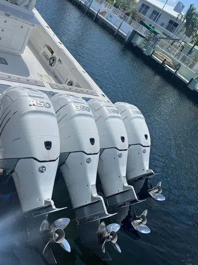  Yacht Photos Pics 2018 Blackwater 43 boat with four powerful outboard engines docked by the water.
