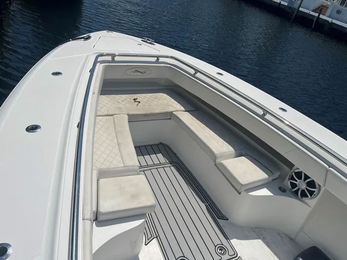  Yacht Photos Pics 2018 Blackwater 43 boat with cushioned seating, docked on calm water.