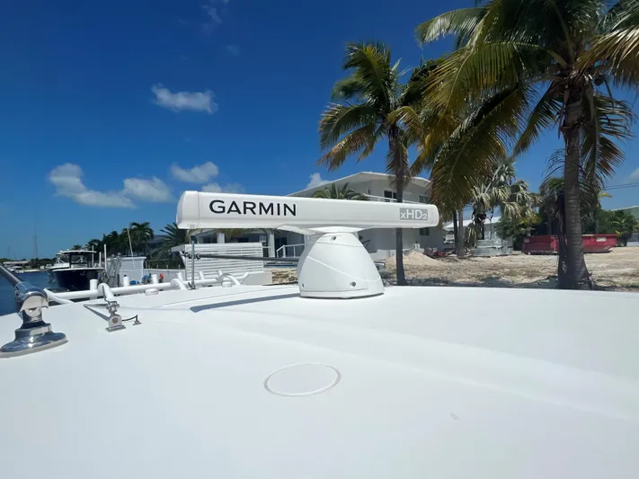  Yacht Photos Pics Garmin radar on 2018 Blackwater 43 boat, with palm trees and blue sky background.