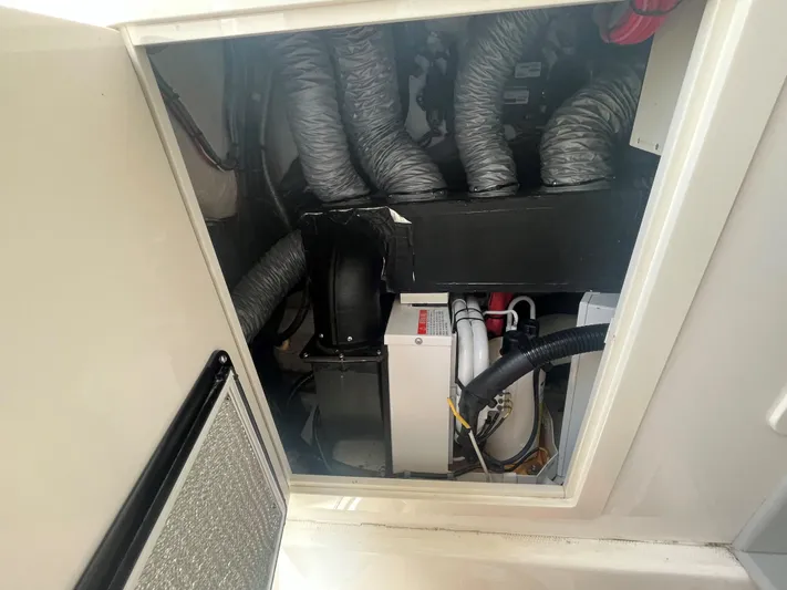  Yacht Photos Pics Engine compartment of a 2018 Blackwater 43 boat, showing mechanical components and wiring.