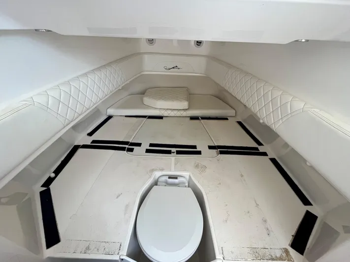  Yacht Photos Pics Interior cabin of 2018 Blackwater 43 boat with white seating and toilet.