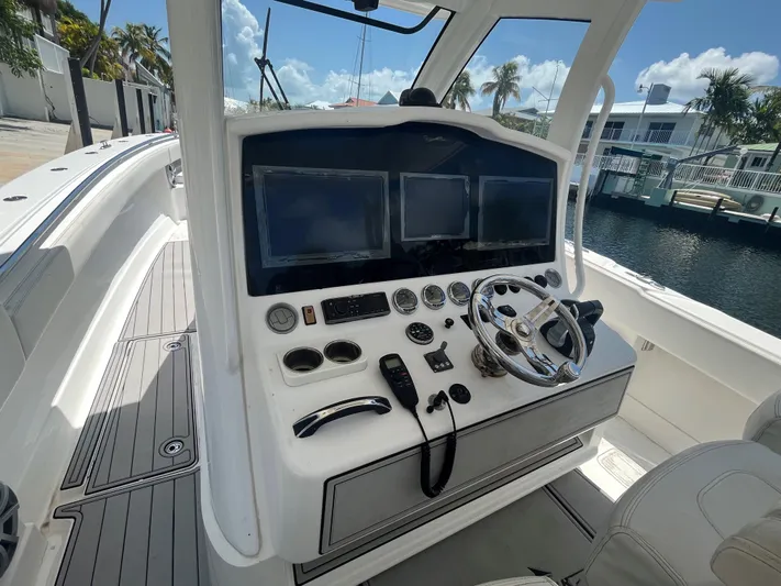  Yacht Photos Pics Cockpit of 2018 Blackwater 43 boat with dual screens and steering wheel.