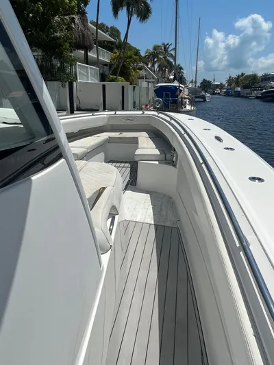  Yacht Photos Pics 2018 Blackwater 43 boat docked by a canal, featuring sleek white design and spacious seating.