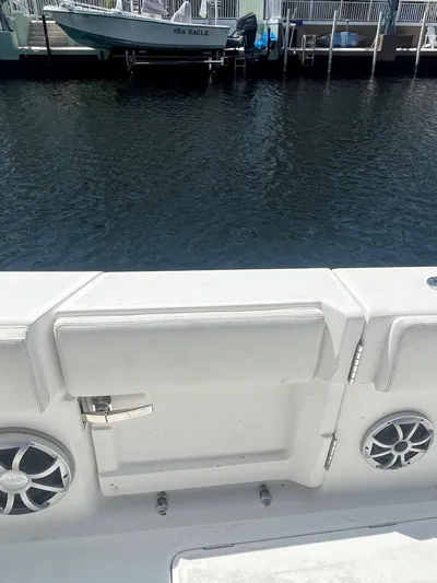  Yacht Photos Pics White Blackwater 43 boat interior with speakers, docked by calm water.