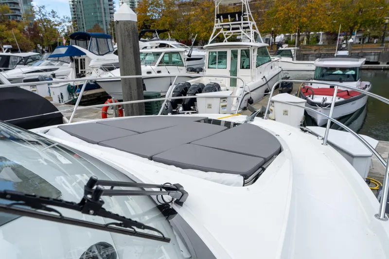 Misty Step Yacht Photos Pics 2023 Beneteau Antares 11 docked, featuring a spacious sunbathing area on the bow.