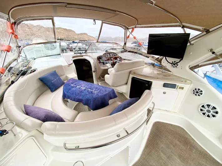 Tangled Up In Blue Yacht Photos Pics Luxurious 2002 Regal 3860 Commodore yacht interior with plush seating and modern amenities.