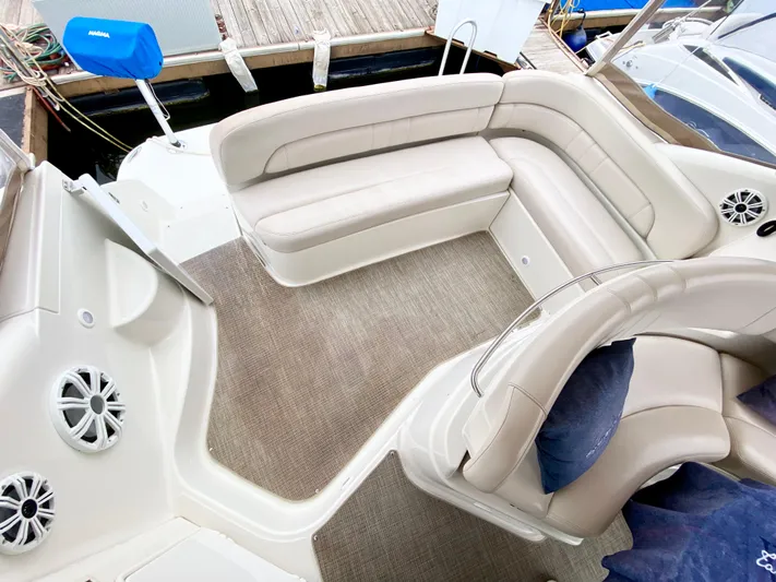Tangled Up In Blue Yacht Photos Pics 2002 Regal 3860 Commodore boat interior with beige seating and carpeted floor.