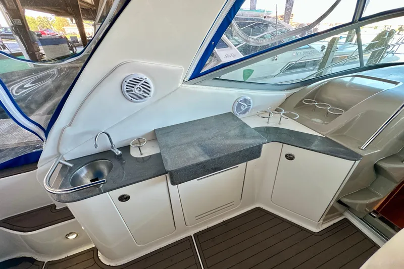  Yacht Photos Pics 2012 Sea Ray 330 Sundancer cockpit with sink, counter, and cup holders.