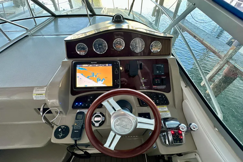  Yacht Photos Pics Cockpit of 2012 Sea Ray 330 Sundancer with navigation system and controls.