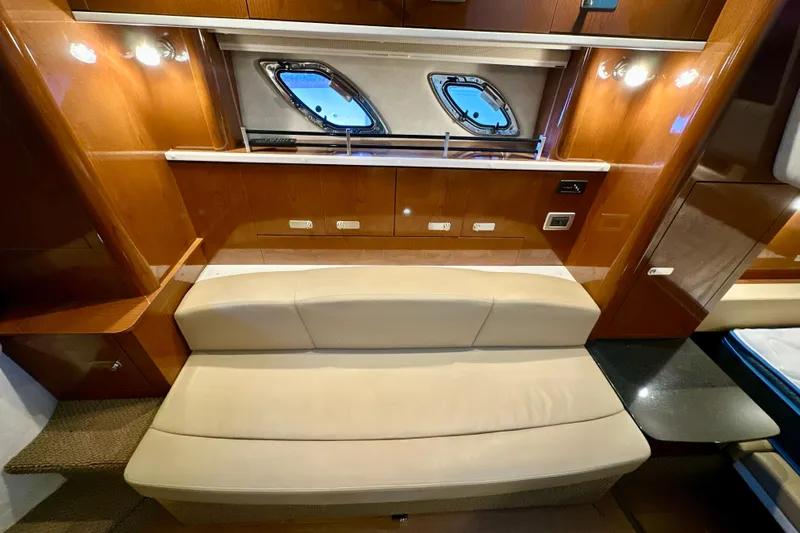  Yacht Photos Pics Interior of 2012 Sea Ray 330 Sundancer with beige seating and wooden cabinetry.