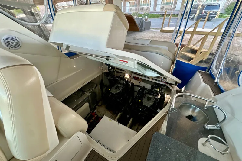  Yacht Photos Pics 2012 Sea Ray 330 Sundancer engine compartment with open hatch, showcasing interior details.