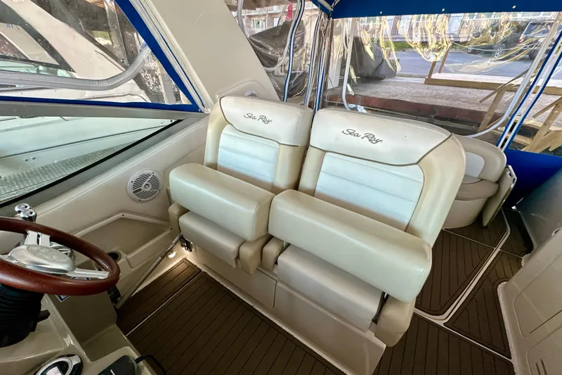  Yacht Photos Pics Interior of 2012 Sea Ray 330 Sundancer with beige seating and wooden accents.
