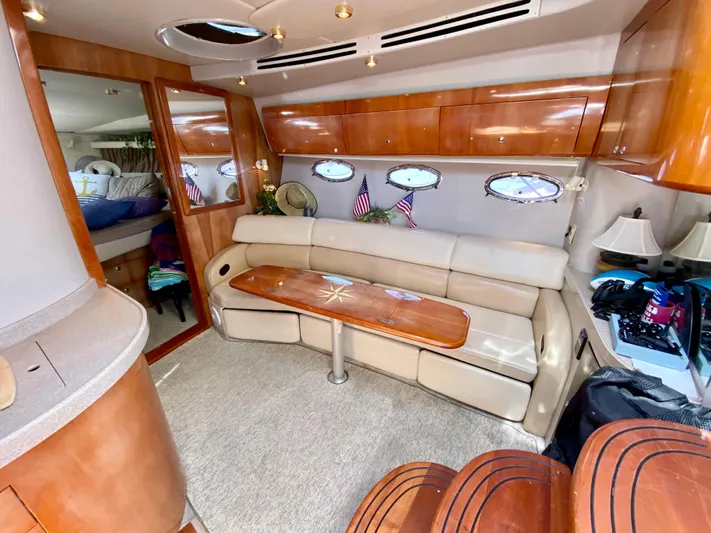 Tangled Up In Blue Yacht Photos Pics 2002 Regal 3860 Commodore yacht interior with leather seating and wooden accents.