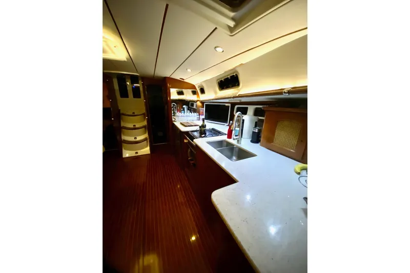Aundrea Lynn Yacht Photos Pics Interior of 1997 Beneteau Oceanis 461 yacht, featuring a modern kitchen with sleek countertops.