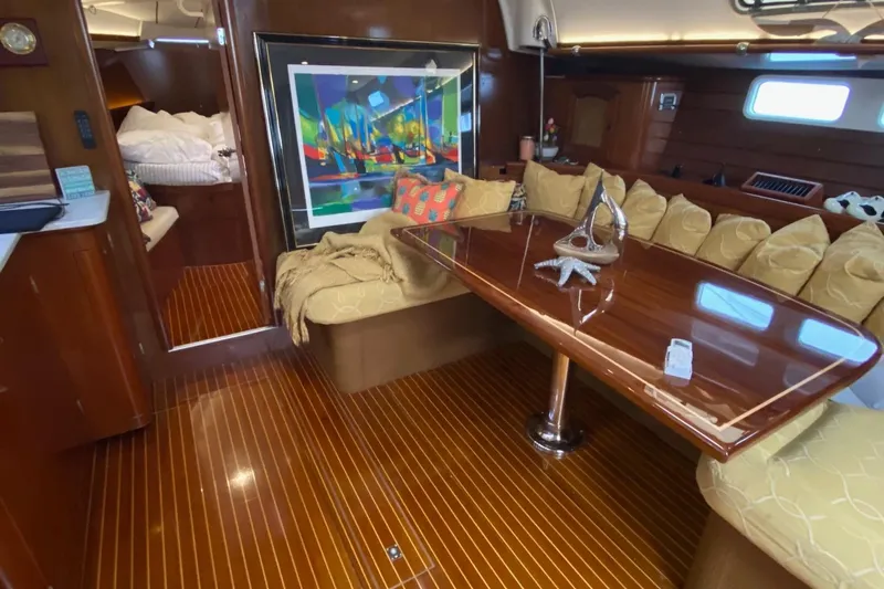 Aundrea Lynn Yacht Photos Pics Luxurious interior of 1997 Beneteau Oceanis 461 yacht with polished wood and cozy seating.