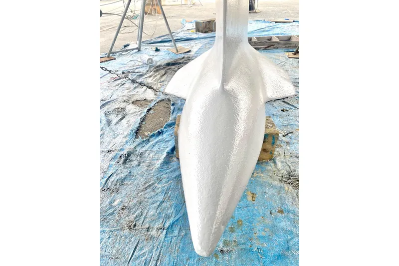 Aundrea Lynn Yacht Photos Pics Close-up of a 1997 Beneteau Oceanis 461 keel on a blue tarp.