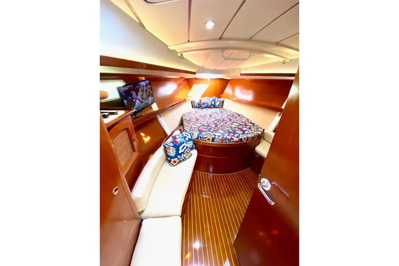 Aundrea Lynn Yacht Photos Pics Luxurious cabin interior of 1997 Beneteau Oceanis 461 yacht with vibrant bedding.